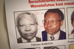 The date of arrest and a red cross are seen written on the face of Felicien Kabuga, one of the last key suspects in the 1994 Rwandan genocide, on a wanted poster at the Genocide Fugitive Tracking Unit office in Kigali, Rwanda, on May 19, 2020.