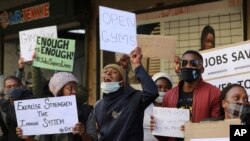 People working in the fitness industry protest in Cape Town, South Africa, Aug. 5, 2020. The industry's governing body, FitSA, estimates that more than 115,000 people have been affected by coronavirus lockdown regulations.