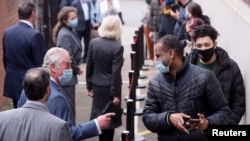 Britain's Prince Charles visits a pop-up COVID-19 vaccination center at the Finsbury Park Mosque, amid the coronavirus disease (COVID-19) pandemic, in London, March 16, 2021.