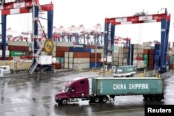 FILE - Containers are seen at the port in San Pedro, California, March 22, 2018.