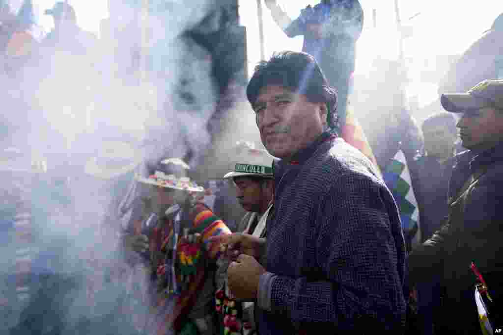 Former President Evo Morales takes part in an offering to Mother Earth before leading a march to Bolivia&#39;s capital, as part of a political dispute with current President Luis Arce and to protest his handling of the economy, in Caracollo, Oruro, Bolivia.