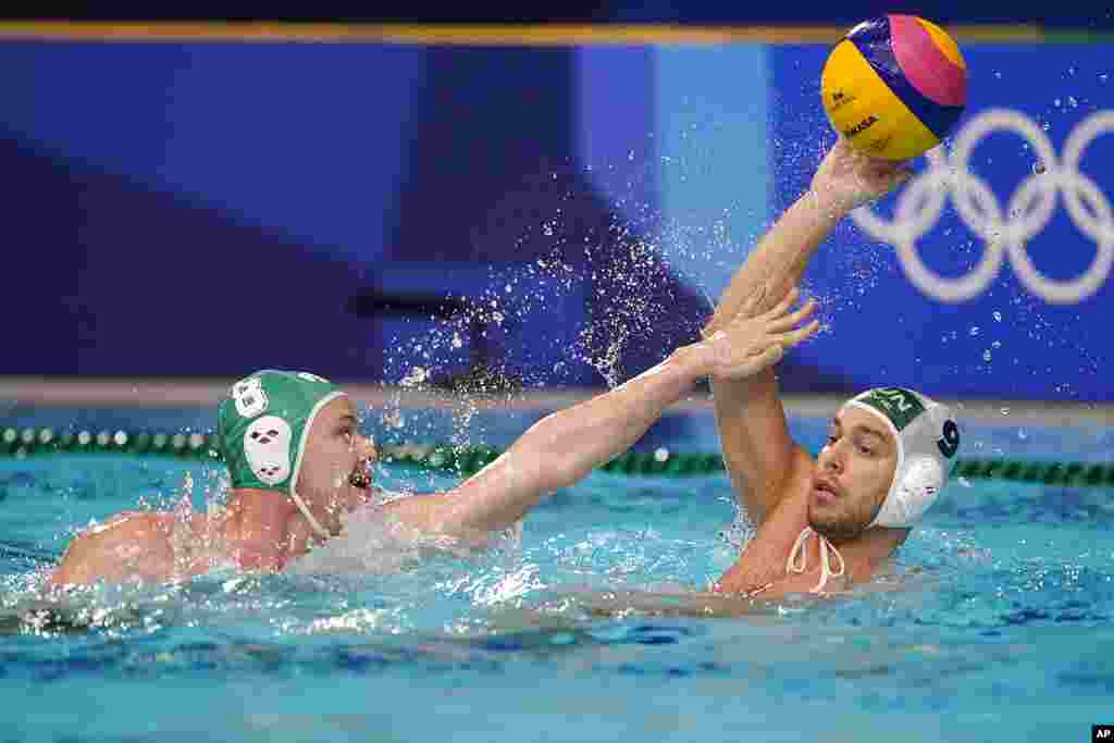 South Africa&#39;s Nicholas Rodda (8) defends against Hungary&#39;s Balazs Erdelyi (9) during a preliminary round men&#39;s water polo match at the 2020 Summer Olympics, Thursday, July 29, 2021, in Tokyo, Japan. (AP Photo/Mark Humphrey)