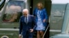 President Joe Biden, left, and first lady Jill Biden arrive on Marine One on the South Lawn of the White House, Aug. 5, 2024, in Washington. 