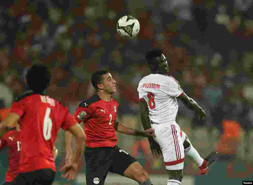 Egypt's Mohamed Abdel-Moneim in action with Sudan's Mohamed Hassoiun during the football match between Egypt and Sudan in Cameroon on Jan. 19, 2022.