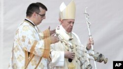 Pope Francis leaves at end of a celebration of Divine Liturgy and the beatification of seven martyred bishops of the Eastern-rite Romanian Catholic Church, in Blaj, Romania, June 2, 2019. 