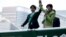 FILE : Tokyo Governor and head of Tokyo Citizens First party Yuriko Koike (R) delivers a speech to voters atop of a campaign van as election campaign officially kicks off for Tokyo Metropolitan Assembly election, on the street in Tokyo, June 23, 2017. 
