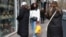 Women walk past a hairdressing salon on March 28, 2024, in Paris. Lawmakers in France's lower house of parliament approved a bill that would ban discrimination over the texture, length, color or style of someone's hair.