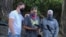 Luke Carrillo, center, speaks about Aaron Danielson at a news conference on Aug. 31, 2020, in Portland, Ore. Danielson, a supporter of the right-wing Patriot Prayer group, was killed on Aug. 29.
