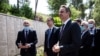 FILE - Greek Prime Minister Kyriakos Mitsotakis, center right, visits The Righteous Among the Nations Memorial during a visit to the Yad Vashem Holocaust Museum in Jerusalem, June 16, 2020. 