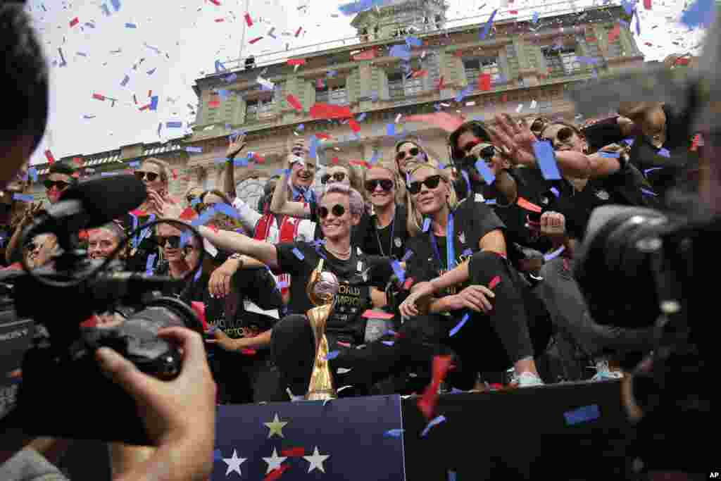 WWCup US Returns Home Soccer. The U.S. women's soccer team celebrates at City Hall after a ticker tape parade, Wednesday, July 10, 2019, AP