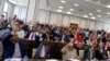 FILE - Somali parliament members raise up their hands to vote, in Mogadishu, Somalia, Sept. 23, 2020. Somalia's prime minister this month announced a 30 percent quota for female lawmakers chosen in upcoming elections. 