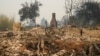 A chimney is left standing amid the ruins of a wildfire-ravaged home enveloped by the CZU August Lightning Complex Fire, Aug. 21, 2020, in Bonny Doon, Calif.