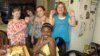 Madison Blandford (far left) and her classmates and neighbors show off their Ugandan beads at Madison's recent jewelry party. (VOA/F. Elmasry)