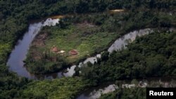 FILE - A village of indigenous Yanomami is seen during a previous Brazil environmental agency operation against illegal gold mining on indigenous land, in the heart of the Amazon rainforest, in Roraima state, Brazil April 18, 2016.