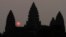 In this Friday, March 20, 2015, file photo, the sun rises behind Angkor Wat at the eastern site of Siem Reap province, some 230 kilometers (143 miles) northwest of Phnom Penh, Cambodia. Visitors who dress immodestly will not be allowed to enter Cambodia's