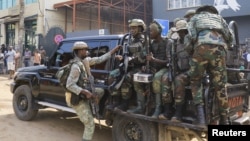 Members of the M23 rebel group gather on their truck after recovering guns during a community exercise aimed at strengthening local solidarity, following their takeover of Bukavu, eastern Democratic Republic of Congo, Feb. 20, 2025. 