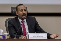 FILE - Ethiopian Prime Minister Abiy Ahmed responds to questions from members of parliament at the prime minister's office in Addis Ababa, Nov. 30, 2020.