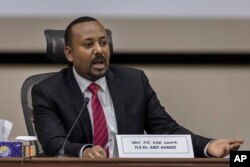 FILE - Ethiopian Prime Minister Abiy Ahmed responds to questions from lawmakers at the prime minister's office in Addis Ababa, Ethiopia, Nov. 30, 2020.