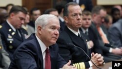 U.S. Secretary of Defense Robert Gates (L) and Chairman of the Joint Chiefs of Staff Adm. Mike Mullen testify at a House Armed Services Committee hearing on Operation Odyssey Dawn and U.S. Military Operations in Libya, Mar 31 2011