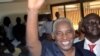 The Guinea Electoral Commission's newly elected president Bakary Fofana waves moments after being elected on November 1, 2012 in Conakry.