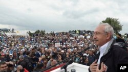 FILE - Lawmakers and supporters listen to a weekly speech by Kemal Kilicdaroglu, right, the leader of Turkey's pro-secular main opposition Republican People's Party, in Kizilcahamam, June 20, 2017. 