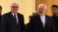 Iranian Foreign Minister Mohammad Javad Zarif (C-R) welcomes with his German counterpart Frank-Walter Steinmeier (C-L) in Tehran, Oct. 17, 2015.