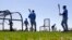 Members of the Tampa Bay Rays take batting practice during a spring training baseball workout in Port Charlotte, Florida, Feb. 26, 2016. 