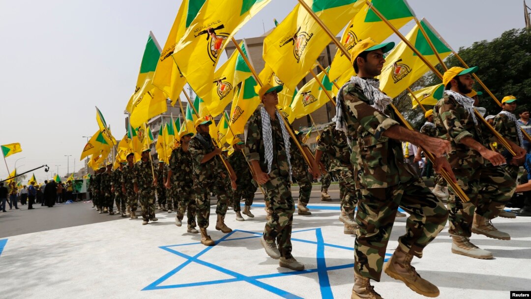 Milisi Syiah Irak yang didukung Iran, Kataeb Hezbollah, melakukan parade di Baghdad (foto: dok). 