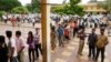 Cambodians wait on a line before they vote at a polling station in Phnom Penh, file photo. 