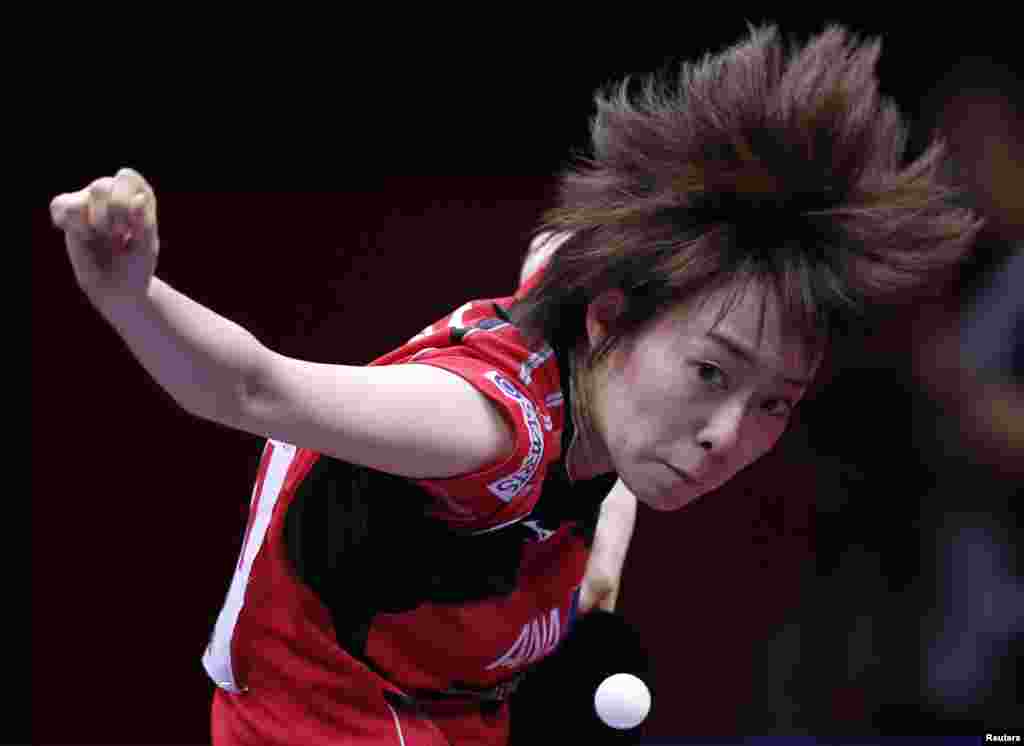 Japan&#39;s Kasumi Ishikawa serves to Hong Kong&#39;s Jiang Huajun during their women&#39;s semi-final match at the World Team Table Tennis Championships in Tokyo.