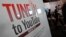 Visitors walk past a YouTube stand during the International Record Music Publishing and Video Music Market (MIDEM) in Cannes, France, Jan. 27, 2013. 