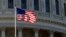 A flag flies on at the U.S. Capitol in Washington, Nov. 28, 2017. The House was set to vote Nov. 29 on adopting mandatory anti-sexual harassment training for all members and their staffs.