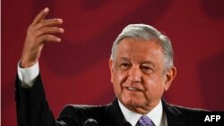 FILE - In this Nov. 13, 2019, photo, Mexican President Andres Manuel Lopez Obrador attends his daily morning press conference at the National Palace in Mexico City. 