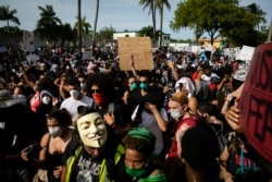 Protesters gather during a rally in response to the recent death of George Floyd while in police custody in Minneapolis, at Fort Lauderdale Police Department in Fort Lauderdale, Florida, May 31, 2020.