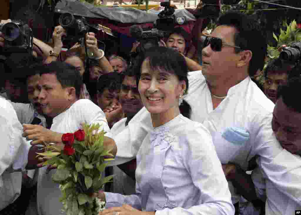 Aung San Suu Kyi arrives at the headquarters of her National League for Democracy party, April 2, 2012, Rangoon, Burma.