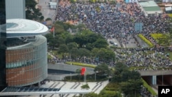 Protesters gather outside the Legislative Council in Hong Kong, Wednesday, June 12, 2019. 