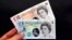 Sample polymer five and ten GB pound banknotes are displayed at the Bank of England in London, Sept. 10, 2013.