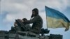 Українські танкісти біля Бахмута, 12 травня 2023 р. AP Photo/Libkos