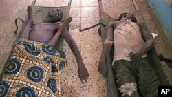 Bodies of three who died from cholera in a makeshift morgue, Liberia, 1996 (file photo).