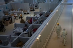 FILE - A general view of a makeshift hospital for coronavirus patients set up at the Sokolniki Exhibition and Convention Center in Moscow, Russia, Nov. 9, 2020.