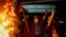 Fire burns as people celebrate along the streets after Luis Fernando Camacho, the governor of Santa Cruz and a prominent opposition leader, was detained by the Bolivian police in Santa Cruz de la Sierra, in El Alto, Bolivia, Dec. 28, 2022. 