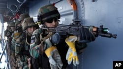 Lebanese army soldiers train on the deck of the Brazilian warship UNIAO, part of the U.N. Interim Force in Lebanon Maritime force, during a joint exercise between the Lebanese army and UNIFIL to apprehend smugglers, off the coast of Beirut, Lebanon, Aug. 23, 2017. 