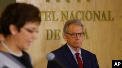 Cuba's vice-minister of transport Marta Oramas Rivero (left) speaks as Jeffrey De Laurentis, United States acting ambassador to Cuba, looks on after the signing of an aero-maritime search and rescue agreement between the two countries in Havana, Cuba, Jan