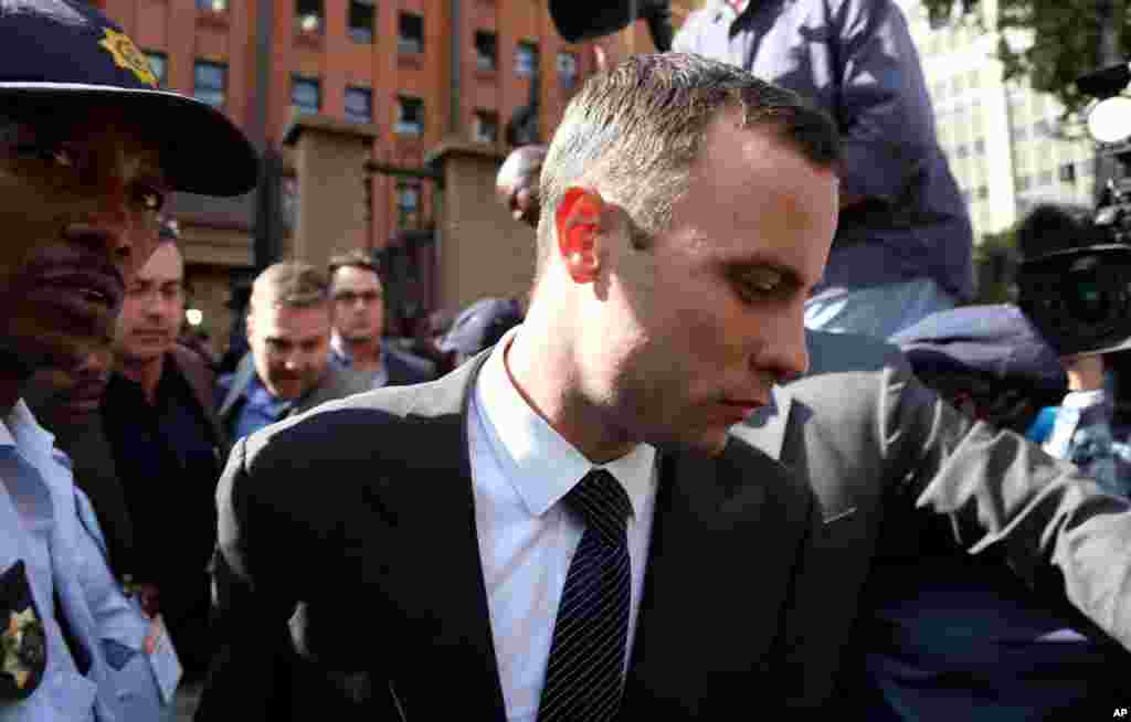 Oscar Pistorius leaves the high court in Pretoria, April 8, 2014. 