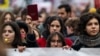 Demonstrators gather in silence in front of the government building in Belgrade, Jan. 24, 2025, after student protest organizers called for a general strike over the fatal collapse of a train station roof in November.