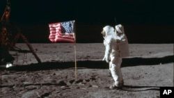  In this photo provided by NASA, astronaut Buzz Aldrin Jr. poses for a photograph beside the U.S. flag on the moon during the Apollo 11 mission on July 20, 1969. (Neil Armstrong/NASA via AP, File)
