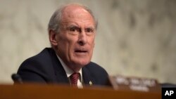 FILE - Then-Indiana Sen. Dan Coats on Capitol Hill in Washington.