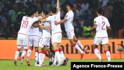 Tunisia's players celebrate after scoring the opening goal during the round of 16 football match between Nigeria and Tunisia in Garoua, Cameroon on Jan. 23, 2022.