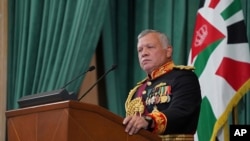 FILE - In this Dec. 10, 2020 file photo released by the Royal Hashemite Court, Jordan's King Abdullah II gives a speech during the inauguration of the 19th Parliament's non-ordinary session, in Amman.