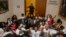 A Capitol Police officer shuts the doors to Florida Gov. Rick Scott's office at 5 p.m. July 17, 2013 as protestors chant in the Capitol in Tallahassee, Florida.